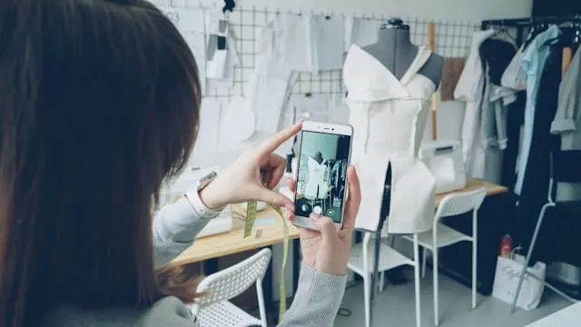 AR try-on app showing digital-physical fashion fusion 2026 on smartphone