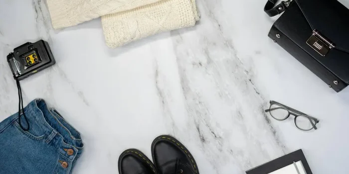 Flat lay of modular clothing and sustainable accessories highlighting 2026 fashion trends including intelligent minimalism