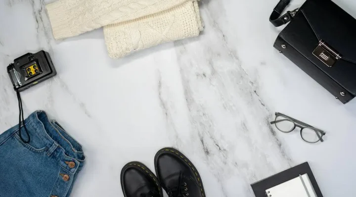 Flat lay of modular clothing and sustainable accessories highlighting 2026 fashion trends including intelligent minimalism